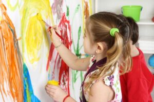 kids-painting-on-wall